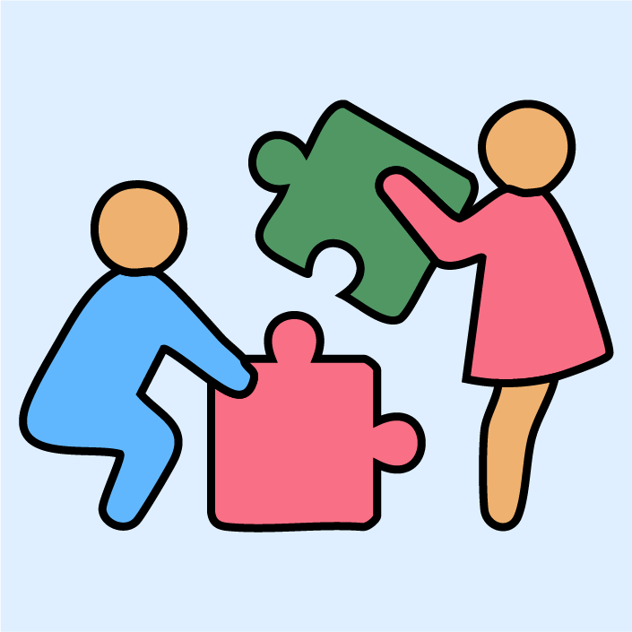 Two kids placing a puzzle piece together, highlighting playful learning in math.